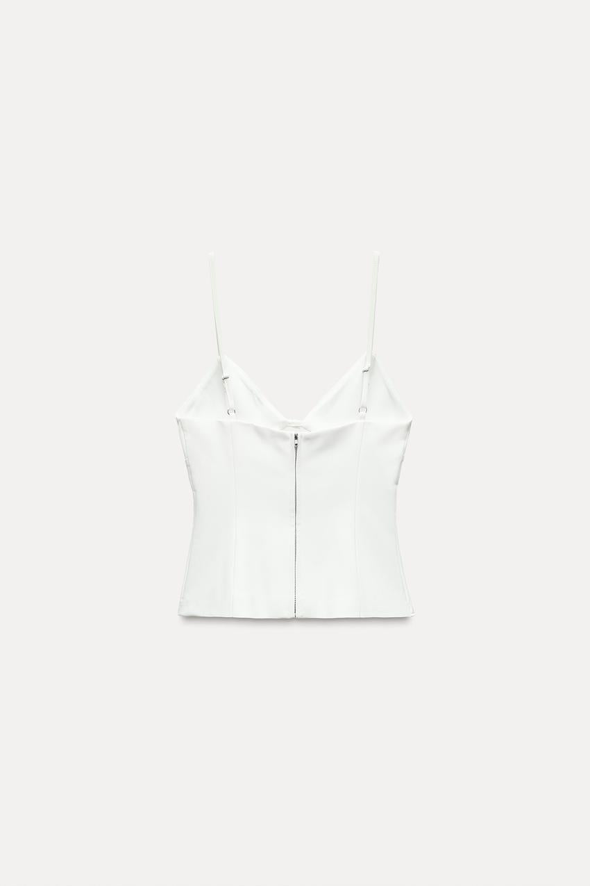 STRETCH TOP WITH CUT-OUT DETAIL AND BOWS